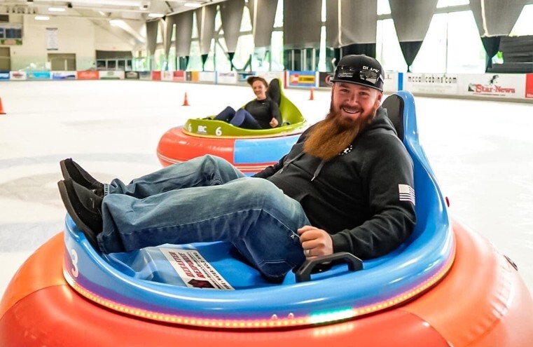 Smiling rider relaxing in an ice bumper car on the rink at Manchester Ice & Event Centre